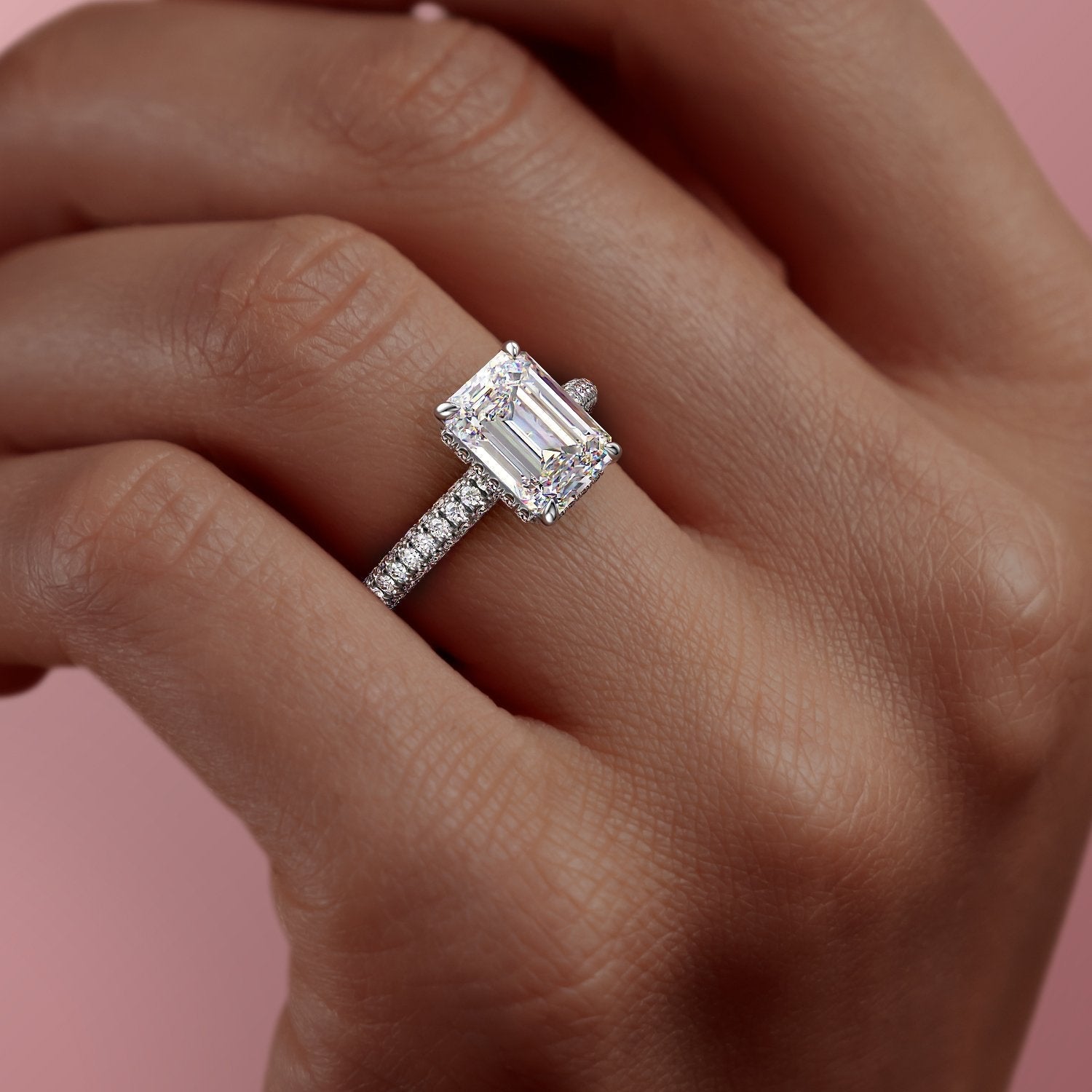 EMERALD CUT MOISSANITE PAVÉ SET SHOULDERS WITH HIDDEN HALO